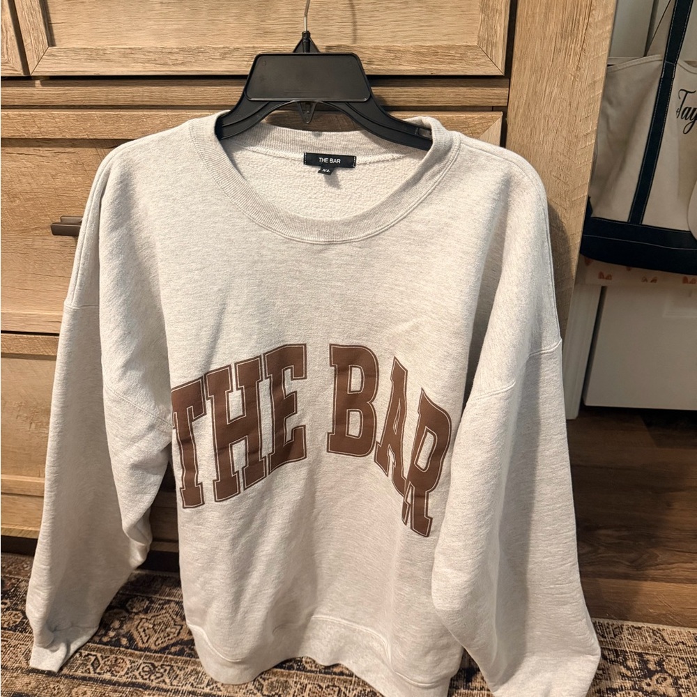 The Bar Light Gray Crewneck Sweatshirt with Black Brand Tag